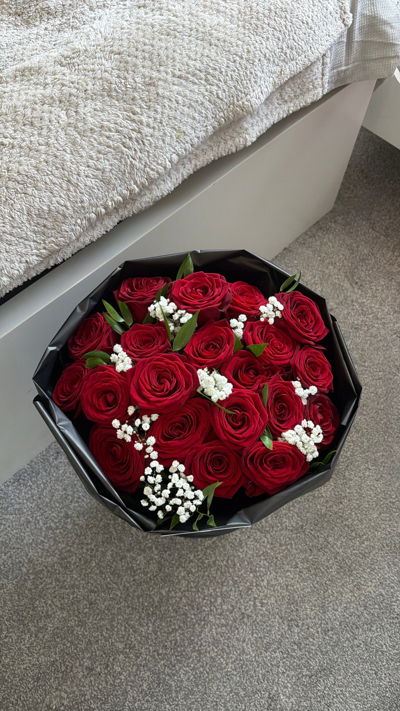 Red roses with greenery